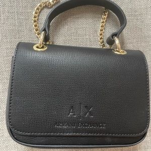 Armani exchange purse. Barely used. Black and gold. Cross body.
